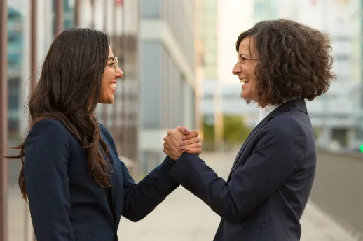 two_woman_shaking_hands